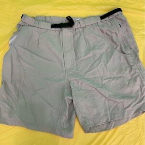 Columbia sportswear company swim trunks with adjustable belt and Velcro pockets.